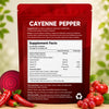 Red supplement package labeled 'Cayenne Pepper' with nutritional information on a wooden surface.