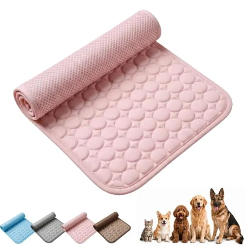 A pink rolled-out cooling mat with a raised bubble texture, shown on a white background with small thumbnails of other color options and several pets (a cat, dog, and two smaller dogs) at the bottom right.